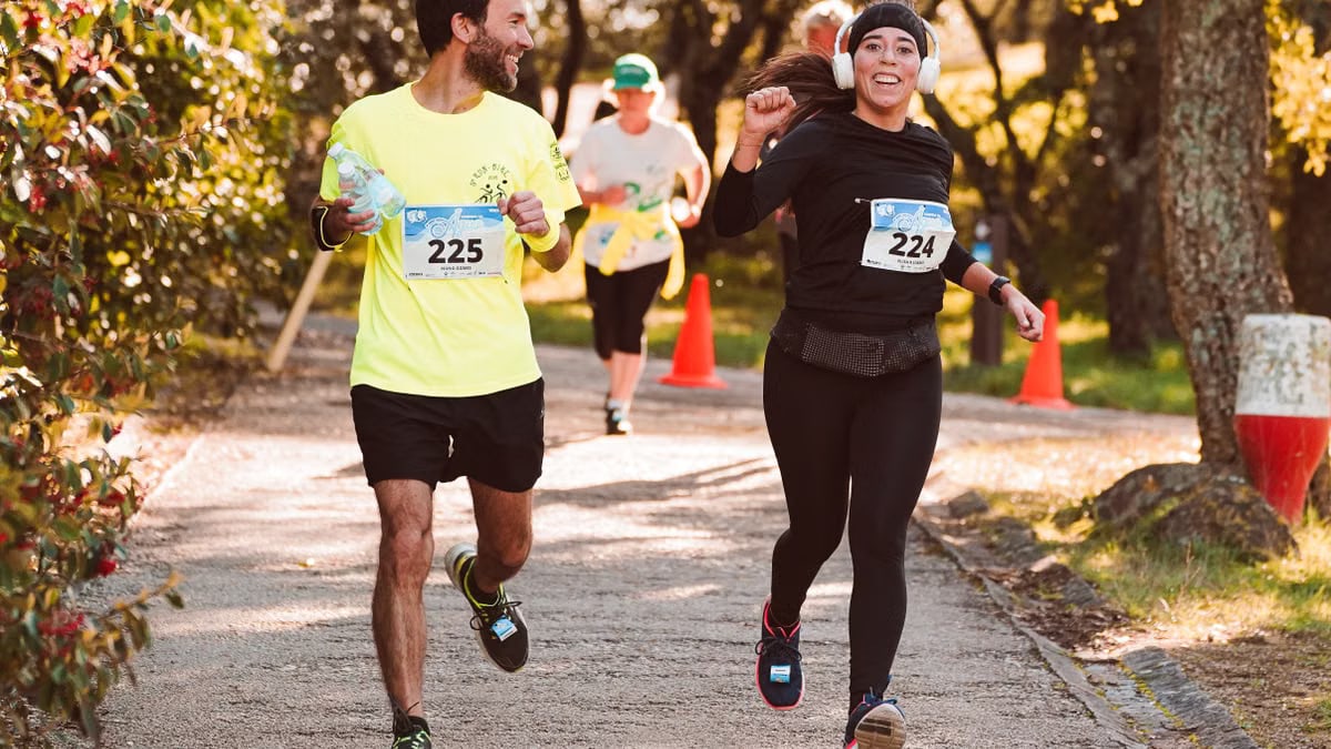 Energetic group of diverse runners enjoying a vibrant outdoor race event.
